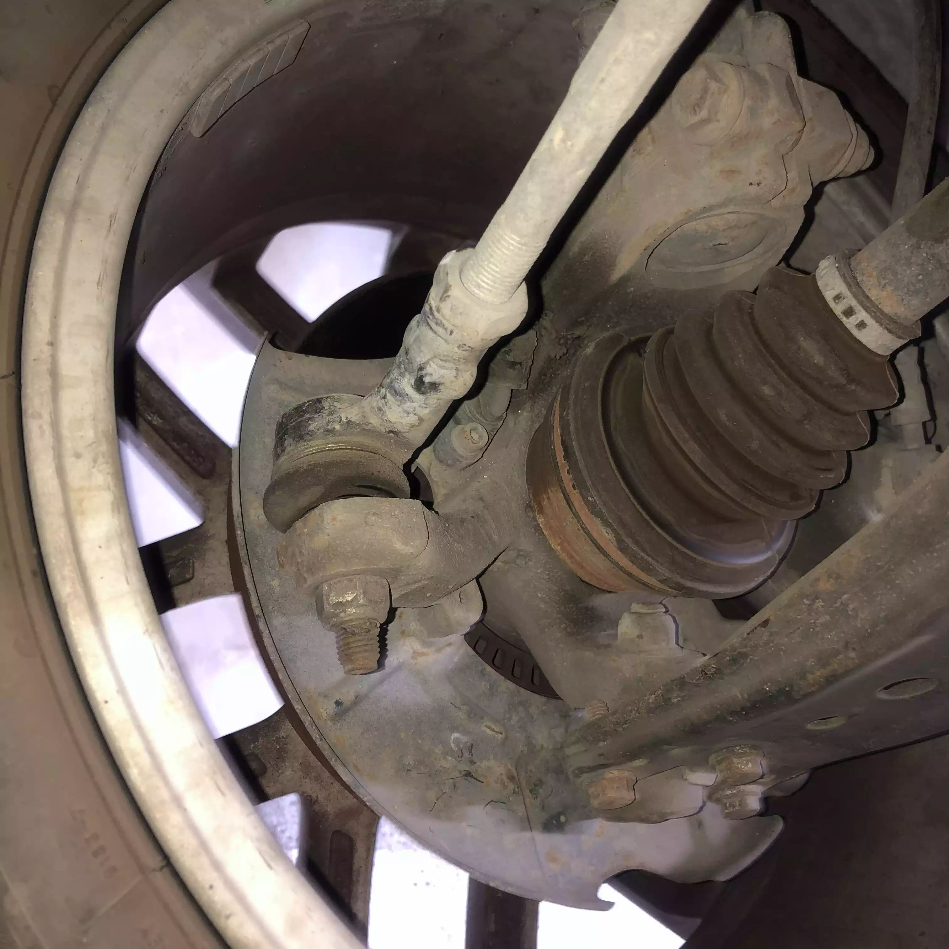 Front tie-rod end and undercarriage inspection.