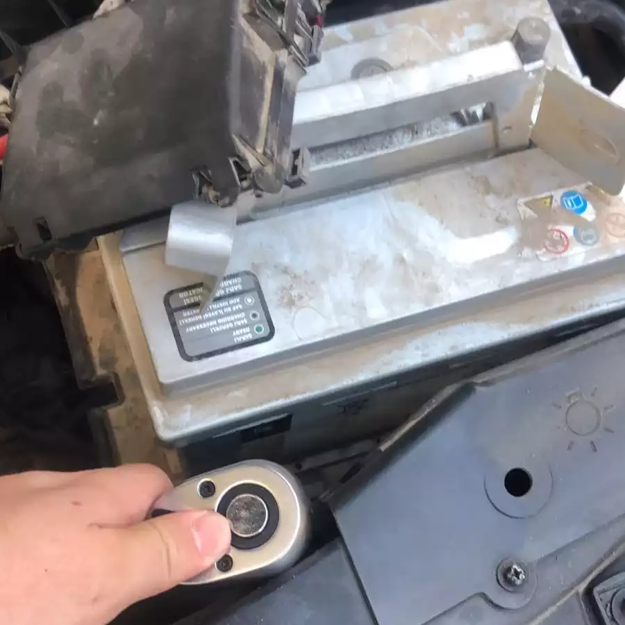 Removing the battery hold-down bracket.